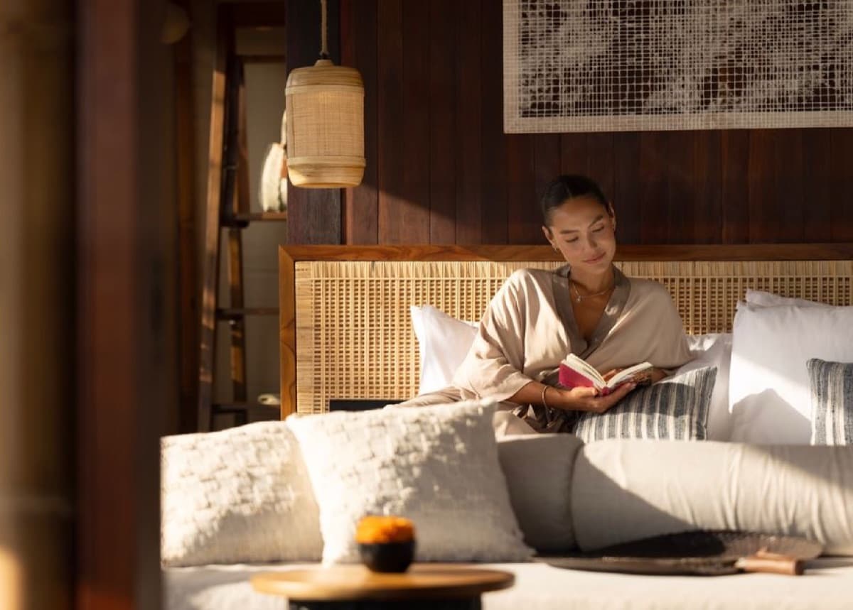 Reading in a quiet villa room with soft daylight
