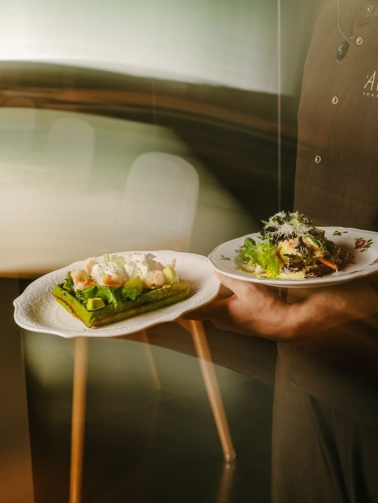 Two plated dishes served at a table